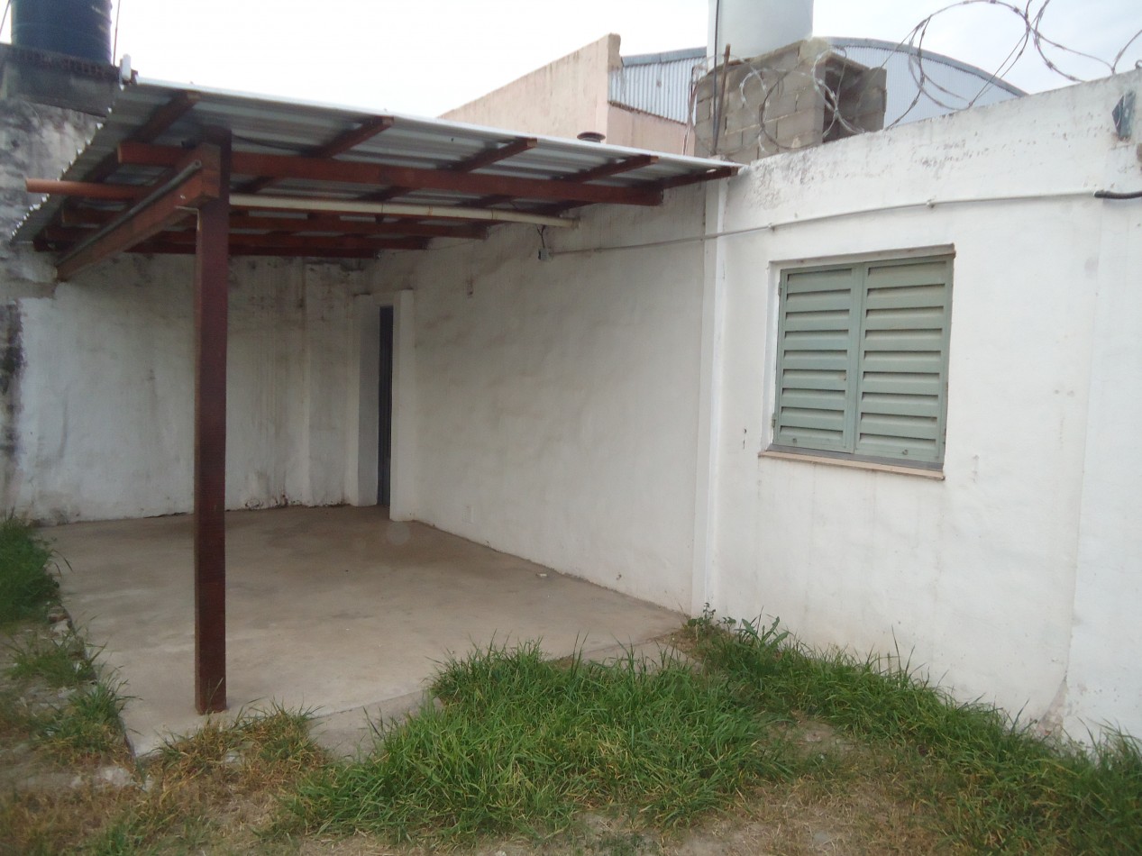 San Roque, Sobre calle principal del barrio.- 