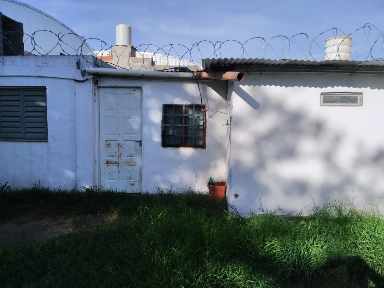 San Roque, Sobre calle principal del barrio.- 